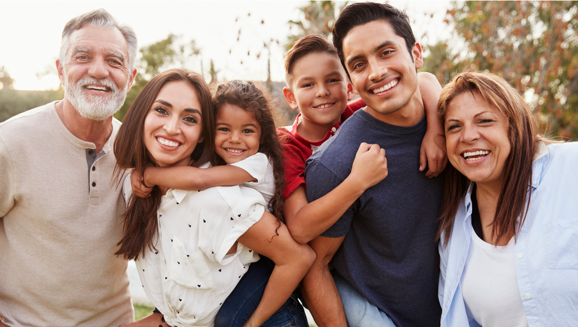A happy multi-generational family outdoors